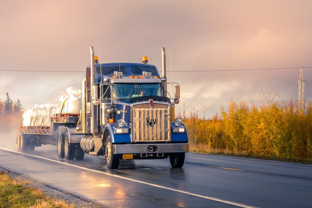 white-and-blue-truck-on-road-during-daytime-mvqtumqh-c0 Truck driving on the road